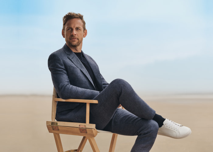 Hackett London male model seated — British menswear collection managed with Nextail